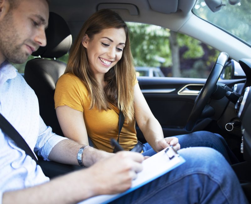 car-instructor-explaining-city-traffic-rules-before-driving-car